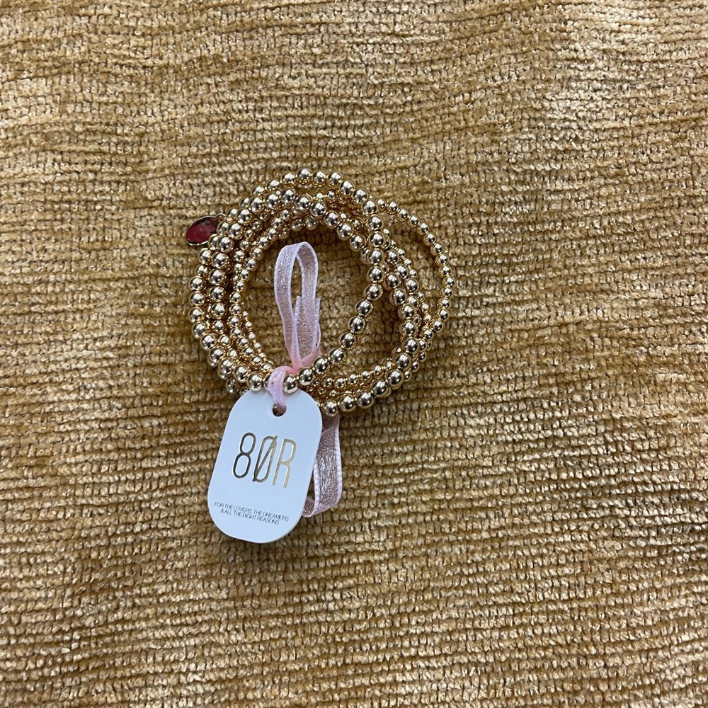 8 Other Reasons set of 5 gold tone beads, stretch bracelets